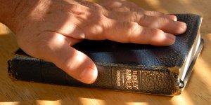 Hand on Bible