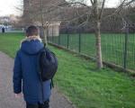 Boy walking home from school