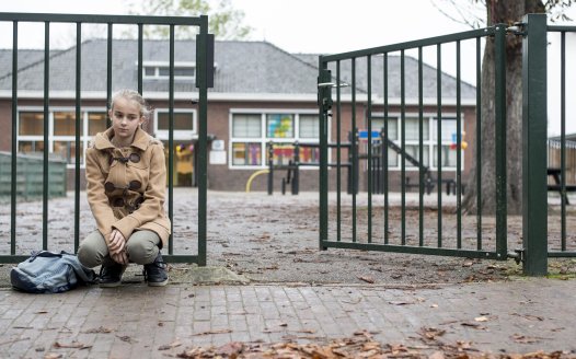 Girl at school gates